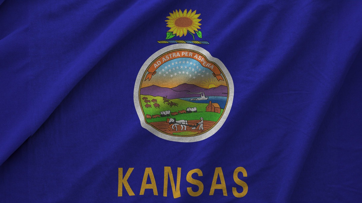 Flag of Kansas displaying the state motto, "Ad Astra Per Aspera."